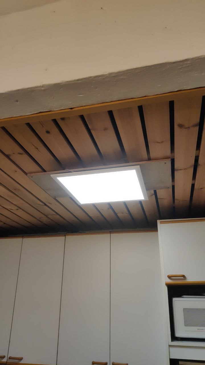 A LED panel installed on a counterceiling in the kitchen